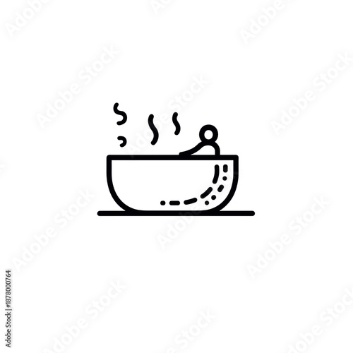 Person enjoying hot bath in large bowl with steam rising  