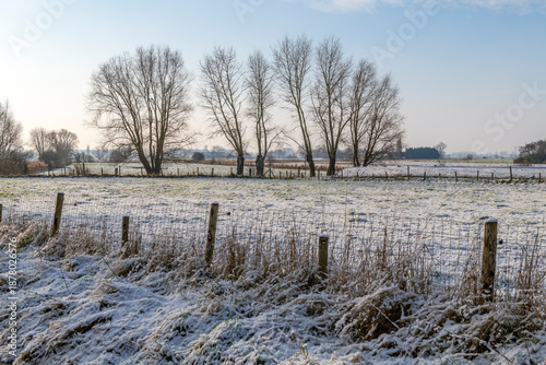 Winter fields in the snow in Gistel between Oostende and Bruges, West Flanders, Belgium.