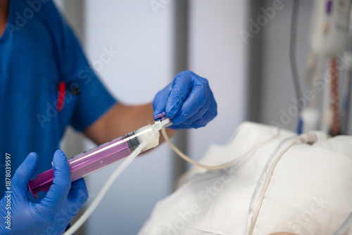 Fotografie Nurse hands preparing syringe for medical feeding
