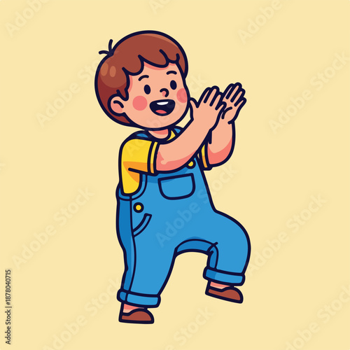 Happy little boy in blue overalls and yellow shirt clapping hands