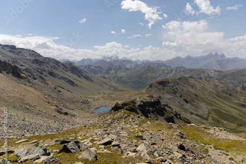 Panoramic view of Lake Roche Noire from Col des Marches, overlooking the Maurienne Valley near Valmeinier in the French Alps