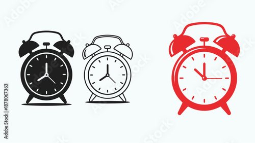 Three alarm clocks in different colors on white and light blue background