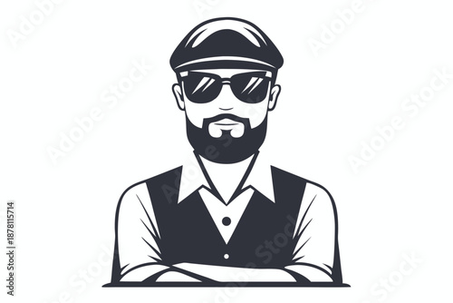Sophisticated bearded man poses wearing cap and sunglasses with his arms crossed looking forward