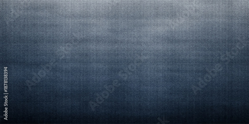 A dark blue denim fabric texture exhibits a rough, macro cotton textile pattern on a grunge clothing material surface, creating a classic fashion backdrop with an old, textured linen feel