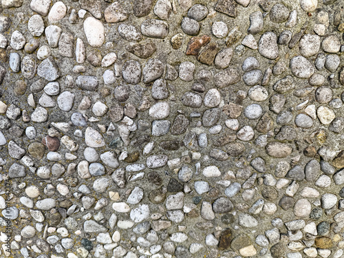 Quadro em tela Pavement background made of small pebbles embedded in concrete