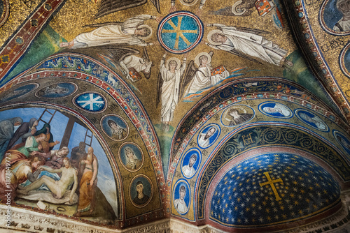 Ravenna, Italy, Ancient Christian vault with gold mosaics of angels, cross, and fresco of Christ's burial in richly decorated interior.