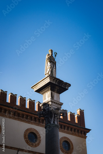 Historic statue of San Vitale atop a column in the public square (Piazza del Popolo) in Ravenna, Italy