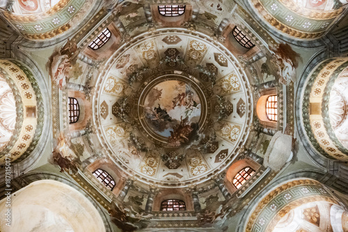 Magnificent frescoed dome of the Ravenna Cathedral featuring religious figures and ornate architectural decorations in Italy