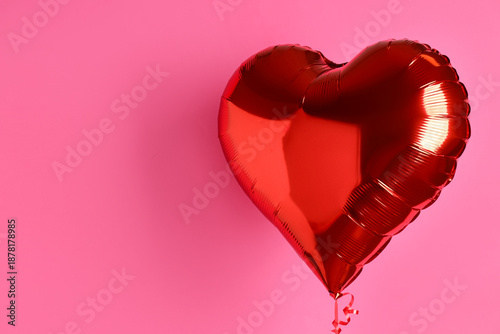 Billede på lærred One heart-shaped balloon on pink background, space for text