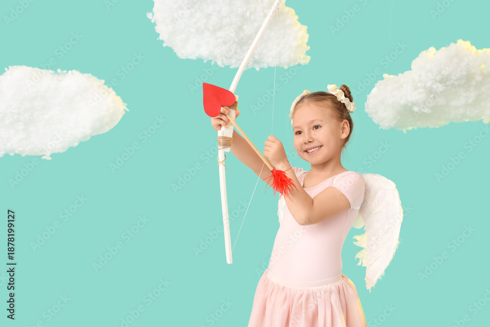 Naklejka premium Cute little girl dressed as cupid with bow and arrow near clouds on blue background. Valentine's Day celebration