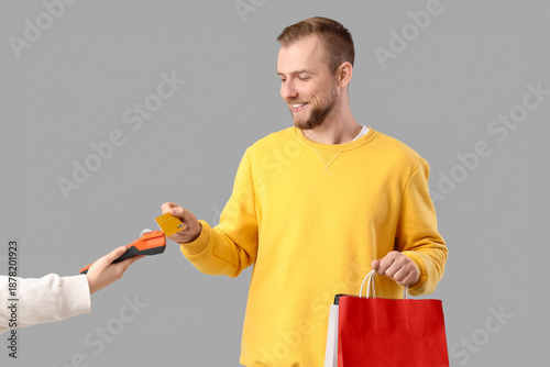 Young man with shopping bag...