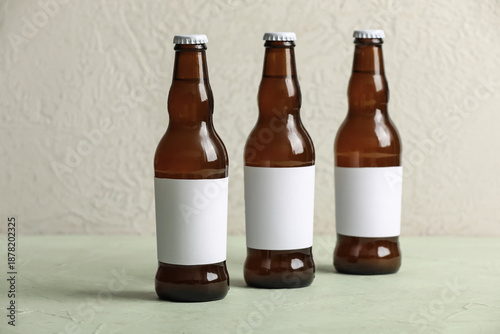 Bottles of cold beer on gre...