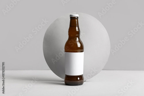 Bottle of cold beer on grey...