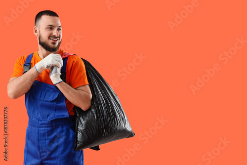 Male scavenger with garbage...