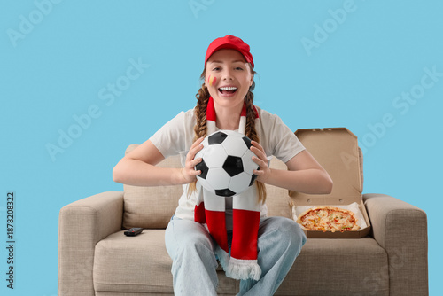 Female soccer fan with ball...