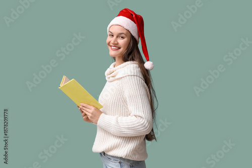Happy young woman in Santa ...