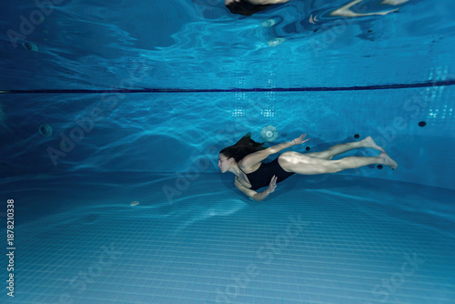 Underwater Female Swimmer Swimming in Pool – Aquatic Sports Photography