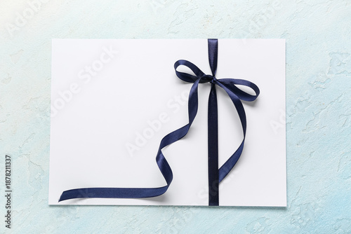 Blank card with bow on ligh...