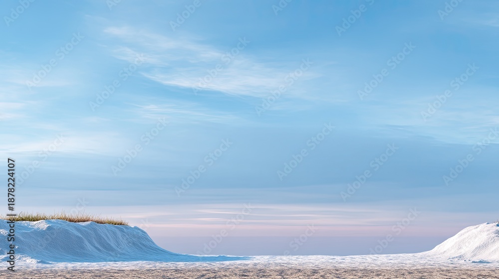 Fototapeta premium Serene Winter Landscape with Snow-Covered Hills and Clear Blue Sky at Dusk, Capturing the Tranquility of a Cold Day Outdoors