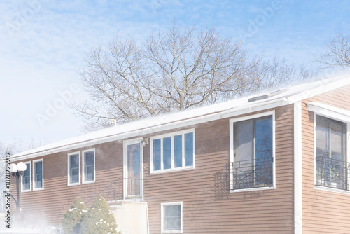 snow in the wind after blizzard around residential house © nd700