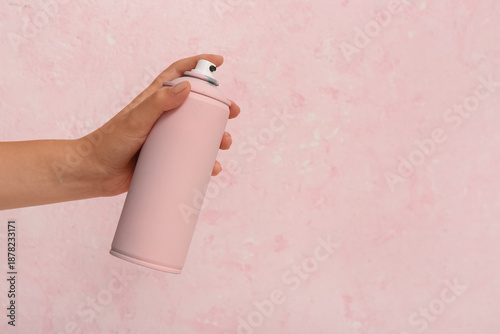Female hand with spray pain...