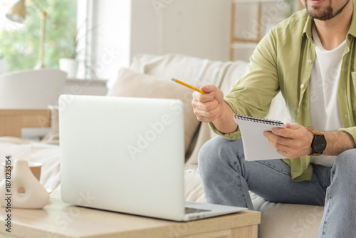 Male teacher with laptop an...