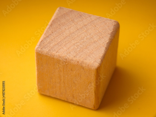 This is a plain wooden cube or block, commonly used as a toy or educational resource