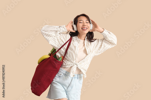 Young Asian woman listening...
