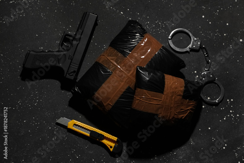 Drug packages with gun, han...