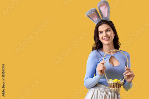 Young woman in bunny ears w...