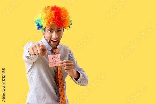 Businessman in clown wig wi...