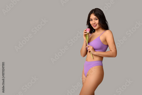 Beautiful young Asian woman...