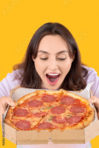 Young woman with tasty pepp...