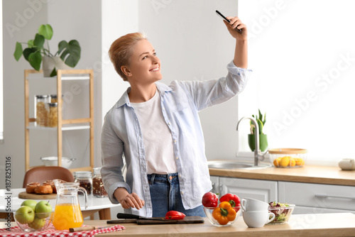 Young woman with mobile pho...