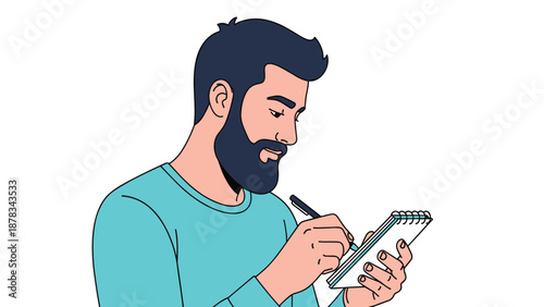Professional man with beard wearing turquoise shirt focuses on writing notes in small spiral notebook during creative work session.