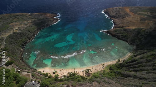 Aerial drone panorama of hanauma bay volcanic crater with turquoise coral reef and sandy beach in honolulu hawaii
