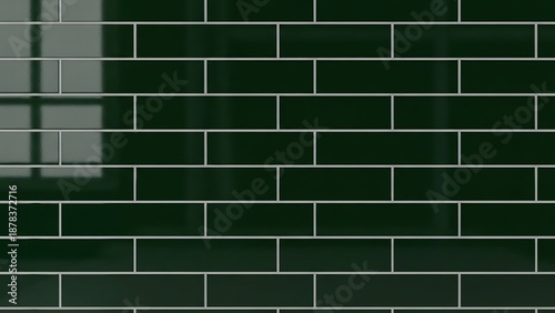 Deep emerald green glossy sandwich chain tiles with light grey grout, reflecting subtle window patterns and light.