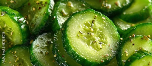 Close-up shot of sliced, seasoned cucumbers, showcasing freshness and texture