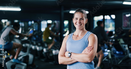 Fényképezés Portrait, personal trainer and woman with arms crossed, gym and confident for fitness in spin class