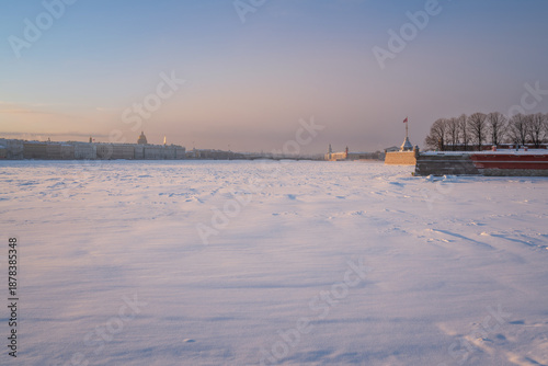 View of the frozen Neva River from the Troitsky Bridge and the city skyline in the background on a freezing winter day, Saint Petersburg, Russia