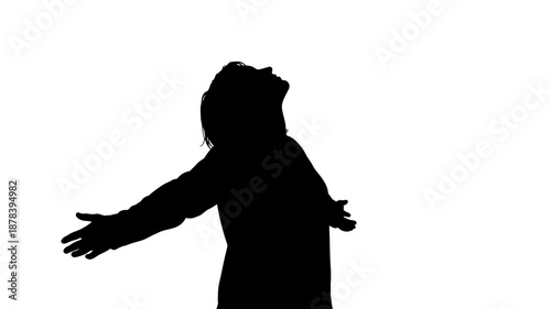 A black silhouette of a person with arms outstretched