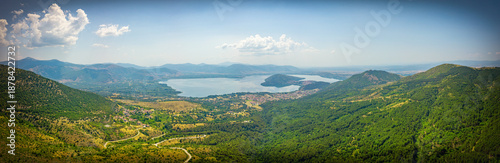 Aerial wide panoramic view of lake Kastoria in Macedonia. The greek land of water is surrounded by mountains 