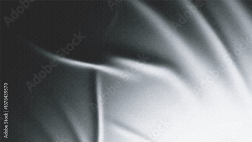 Grainy textured abstract study of light and shadow on draped fabric