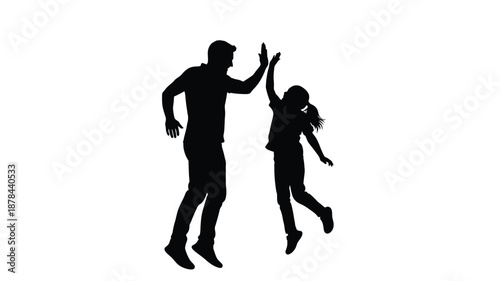 Father and daughter celebrating success with a high five silhouette