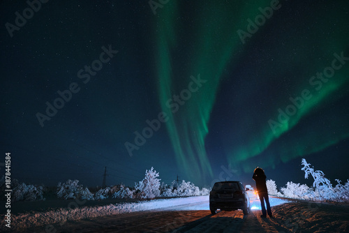 car against the backdrop of the northern lights