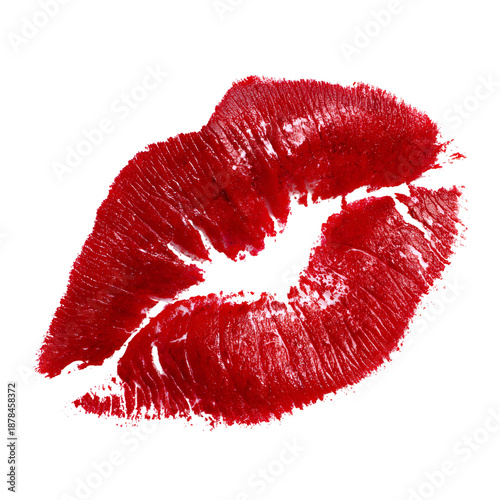 Vibrant red lipstick kiss mark on black background