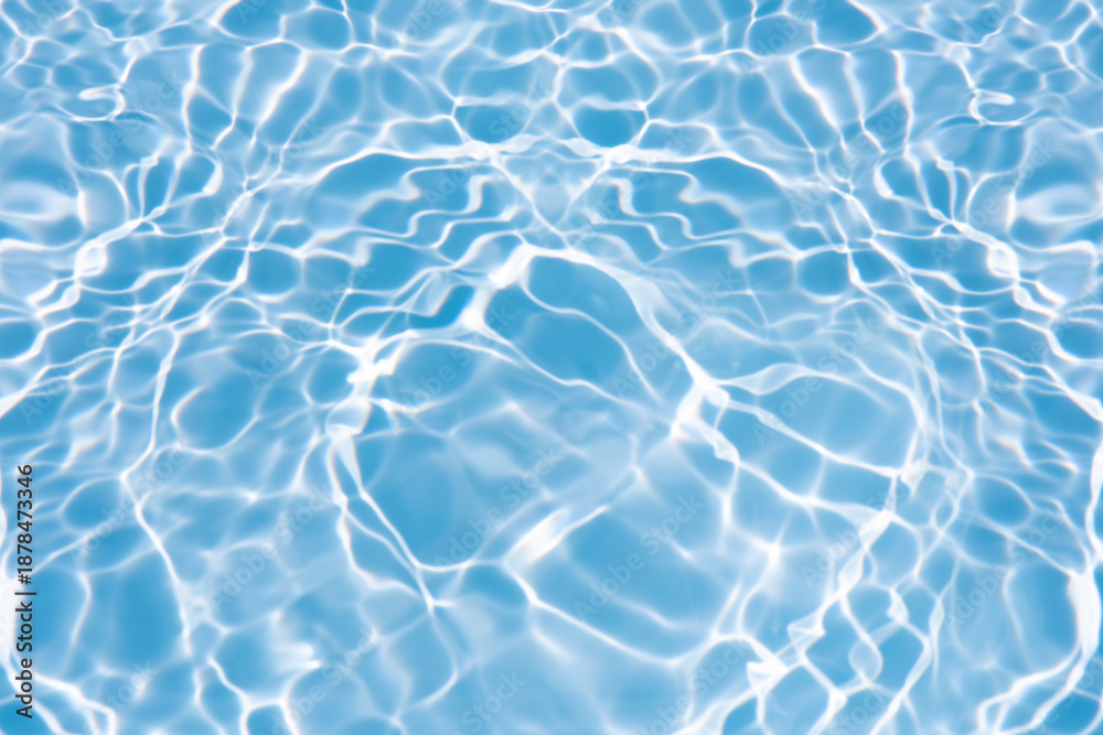 Obraz premium Blue water with ripples on the surface. Defocus blurred transparent blue colored clear calm water surface texture with splashes and bubbles. Water waves with shining pattern texture background.