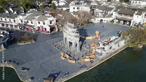 Xidi, China: Aerial drone footage of the famous Xidi ancient village with an orbit motion around its famous paifang, a memorial archway, near Huangshan in Anhui province in China. 