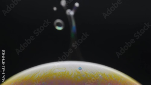 Closeup of soap bubble shapes forming.