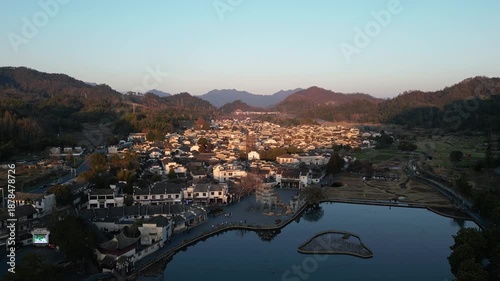 Xidi, China: Dramatic aerial drone footage of the traditional Xidi ancient village at sunset near Huangshan in Anhui province in China. 